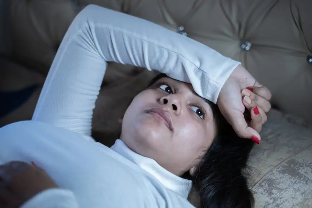 A young woman reclined on the couch